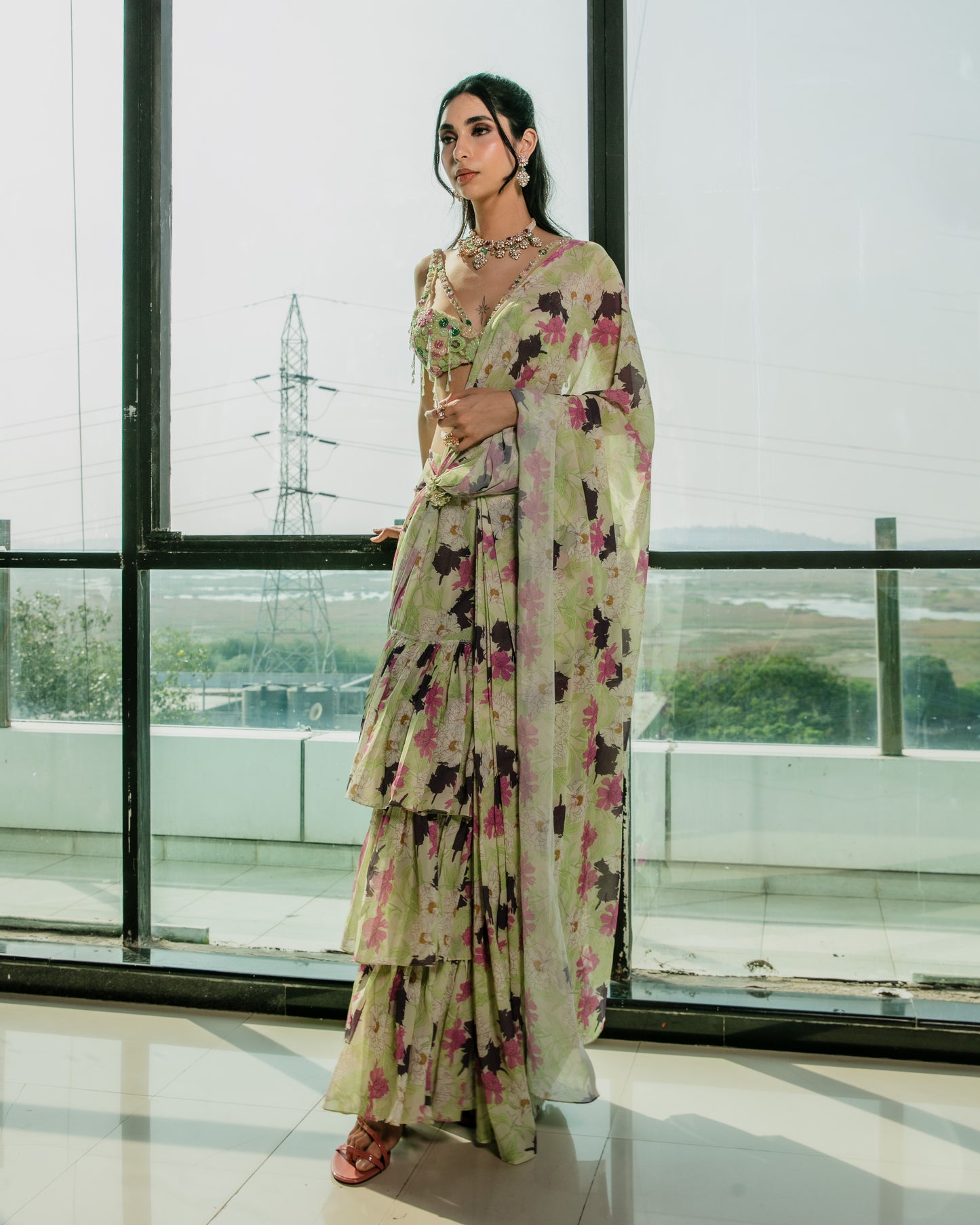 Pre draped ruffle saree with a cutout embroidered blouse