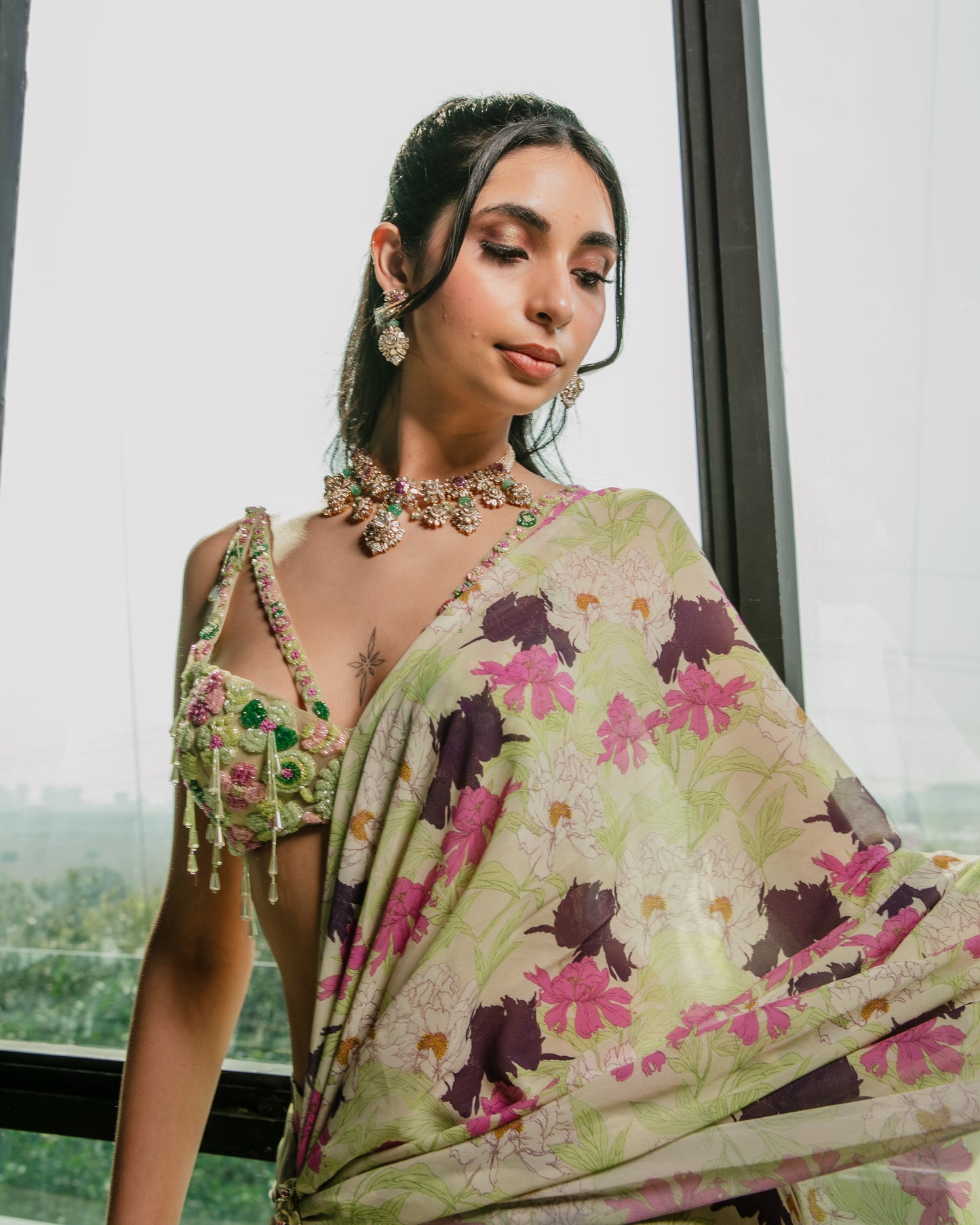 Pre draped ruffle saree with a cutout embroidered blouse